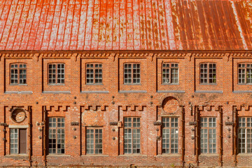 Kouvola, Finland - 15 September 2020: Old red brick buildings of Upm factory on rapids Kuusankoski.