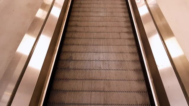 Standing on a moving walkway. Walking Elevator POV.