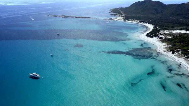 Aerial Drone View over La Cinta Beach, San Teodoro, Emerald Coast, Sardinia, Italy.
Caribbean Cristal Clear Turquoise Water.