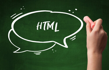 Hand drawing HTML abbreviation with white chalk on blackboard