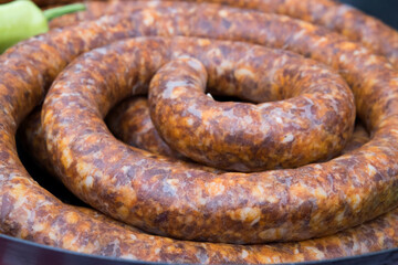Traditional Serbian meat fst food - grilled sausages on bbq