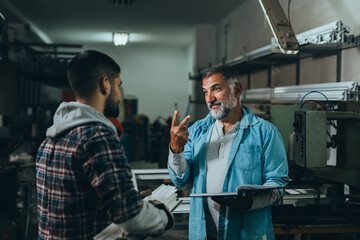 Obraz premium Aluminium and PVC industry workers talking