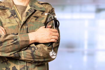 Cropped shot of an unrecognizable male military doctor standing with his arms folded inside of a...