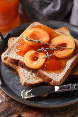 Toast with jam. Apricot jam with berries. Fruit jam for Breakfast. Fresh and healthy Breakfast with toast