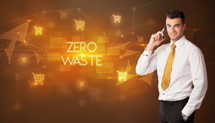 Businessman with shopping cart icons and ZERO WASTE inscription, online shopping concept