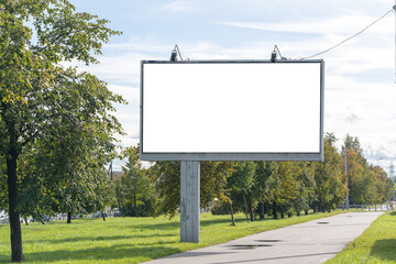 Billboard ad near the park. - obrazy, fototapety, plakaty
