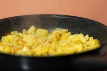 The potatoes are cooked in a pan. Frying potatoes.