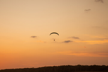 Paraglider Over Sunset