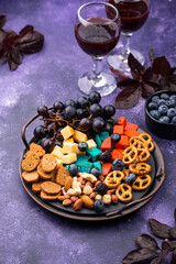 Halloween appetizers. Cheese plate with snacks