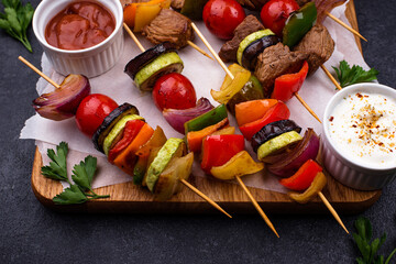 Grilled kebabs with meat, mushrooms and vegetables