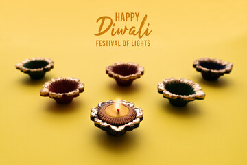 Happy Diwali - Clay Diya lamps lit during Dipavali, Hindu festiv