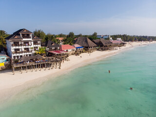 Top Aerial view on the beautiful white sand ocean coast in Nungwi at Zanzibar island, Tanzania