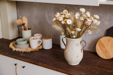 kettle kitchen corner decoration and yellow tulips with bib
