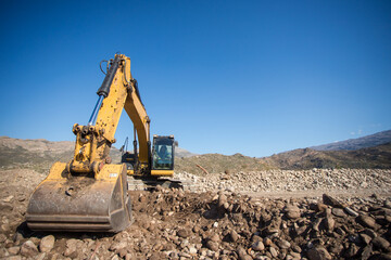 Fototapeta na wymiar Close up wide angle image of an excavator machine working on an agricultural farm