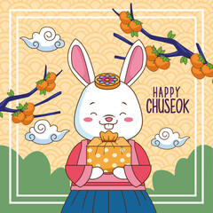 happy chuseok celebration with rabbit lifting gift and branches trees