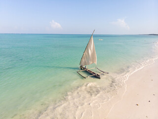 Dhow Catamaran sail boat near the White sand Beach in Paje village on Zanzibar