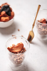 Breakfast with granola. Granola with Chia and apricot. Light background. Healthy breakfast. Wholesome breakfast