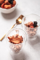 Breakfast with granola. Granola with Chia and apricot. Light background. Healthy breakfast. Wholesome breakfast