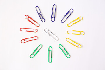 Colored paper clips close-up on a white background