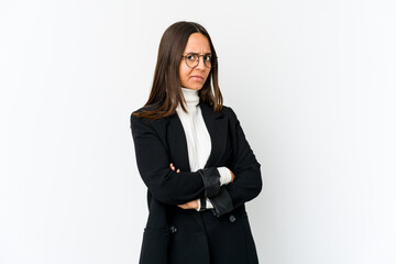 Young mixed race business woman isolated on white background suspicious, uncertain, examining you.