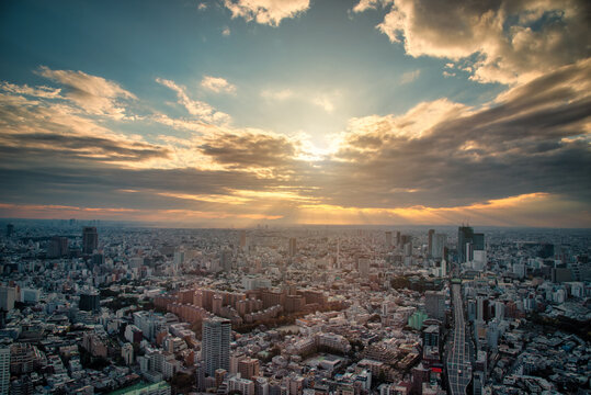 Tokyo Skyline and view of skyscrapers on the observation deck at sunset in Japan.