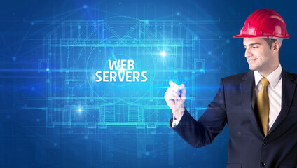 Handsome architect with helmet drawing WEB SERVERS inscription, new technology concept