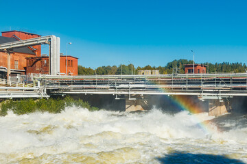 Beautiful rainbow on bypass at rapids Kuusankoski, Finland