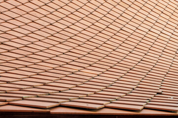 Roof background, Traditional Thai style roof in temple, Thailand.red roof tiles texture background
