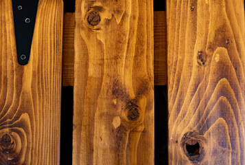 Background and texture of beautiful wooden boards with knots