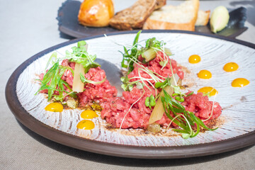 tasty Steak tartare (Raw beef) - classic steak tartare on white plate