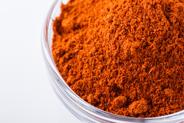 aromatic spicy chili powder on a white background