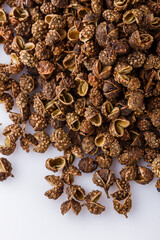 fragrant Sichuan pepper on white acrylic background