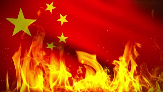 Fire, flames and burning embers in-front of the National Flag of the People's Republic of China.