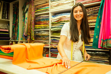business lady shop owner cashmere yak wool shawls.female seller in goa india