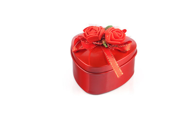 Red color heart shape gift box on white background	
