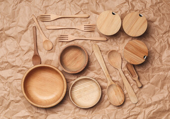 Set of modern cooking utensils on brown parchment, flat lay