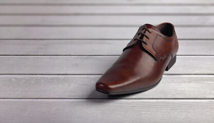 Men's formal leather Shoes isolated on wooden table