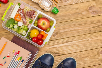 Healthy lunch box and colorful stationery.