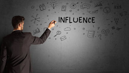 businessman drawing a creative idea sketch with INFLUENCE inscription, business strategy concept