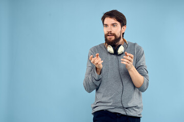 man wearing headphones music emotion lifestyle modern style technology blue background