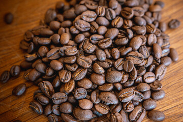 Coffee beans on wood closeup