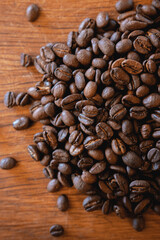 Coffee beans on wood closeup