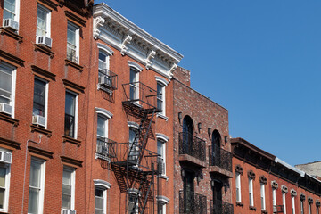 Row of Old Brick Buildings in Williamsburg Brooklyn of New York City with Fire Escapes