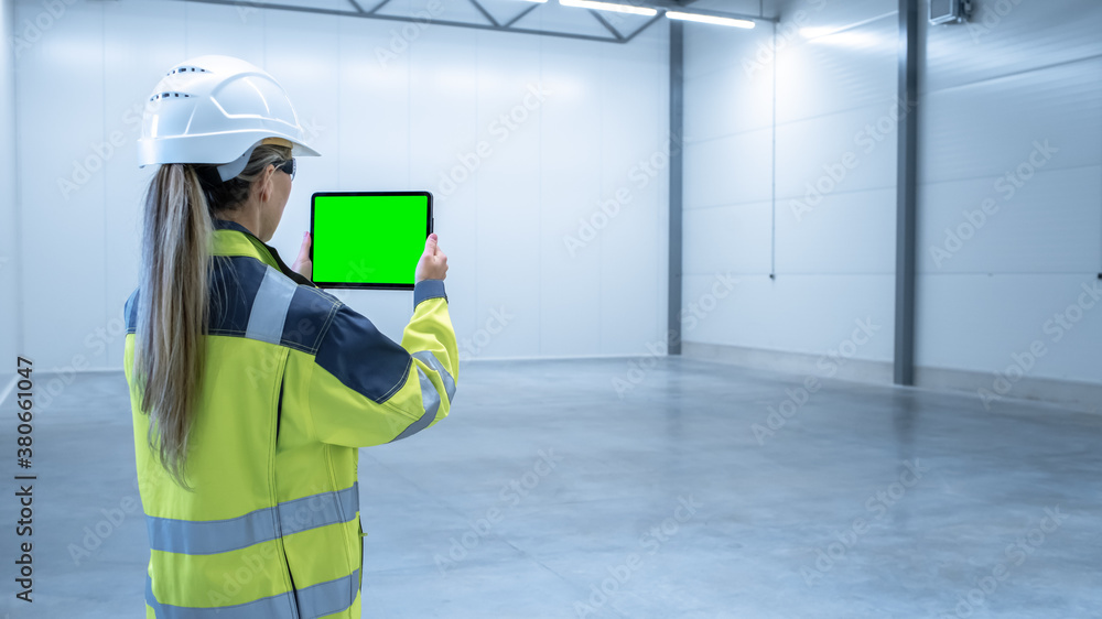 Poster Industry 4.0 Modern Factory: Female Engineer Uses Digital Tablet Computer with Green Screen Mock-up Template Suitable for Visualizing Augmented Reality Software of Mapping Manufacturing Plant Room.