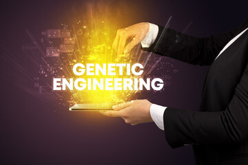 Close-up of a touchscreen with GENETIC ENGINEERING inscription, innovative technology concept