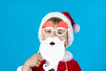 Fototapeta na wymiar Happy child with Christmas paper props