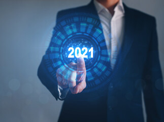 Businessman pointing future button of year 2021. Development to success and growing growth concept. 
