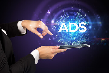 Close-up of a touchscreen with ADS abbreviation, modern technology concept
