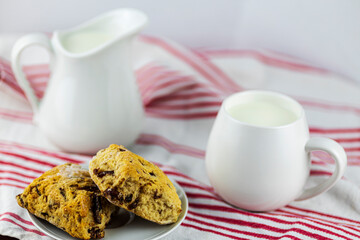white milk jugs with scones
