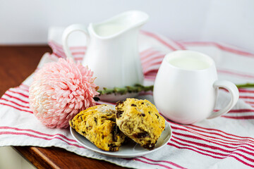 milk jugs, scones nad pink flower